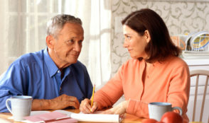 Older man and caregiver daughter discuss finances