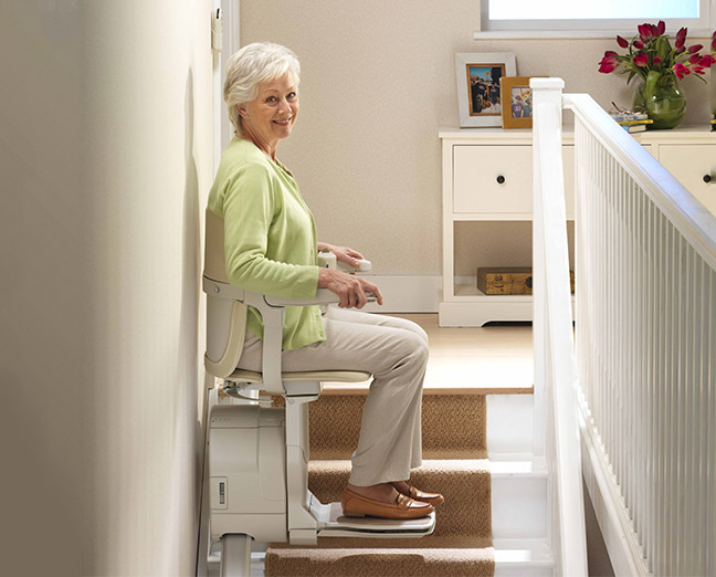 stannah stairlift Siena closed white color with the user seated